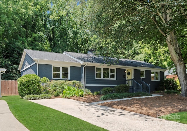 1027 Dresden Dr W, Charlotte, NC 28205 - ranch-style home with a chimney, a shingled roof, and brick siding