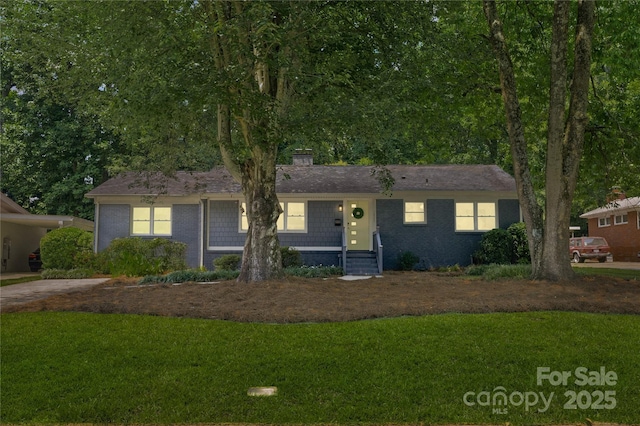 1027 Dresden Dr W, Charlotte, NC 28205 - single story home with a front lawn and a chimney