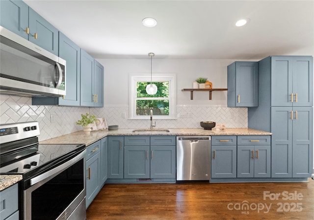 1027 Dresden Dr W, Charlotte, NC 28205 - kitchen featuring appliances with stainless steel finishes, blue cabinetry, tasteful backsplash, open shelves, and recessed lighting