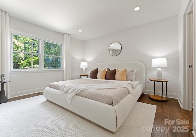 1027 Dresden Dr W, Charlotte, NC 28205 - bedroom with dark wood-style floors and recessed lighting