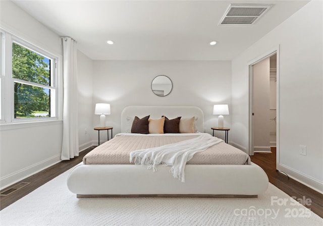 1027 Dresden Dr W, Charlotte, NC 28205 - bedroom with wood finished floors and recessed lighting
