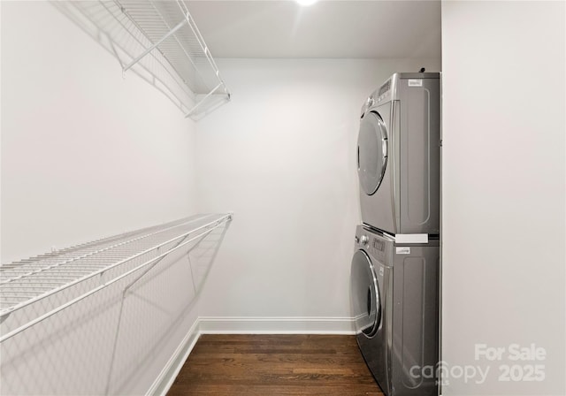 1027 Dresden Dr W, Charlotte, NC 28205 - laundry room featuring stacked washer / dryer and dark wood-type flooring
