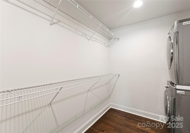 1027 Dresden Dr W, Charlotte, NC 28205 - spacious closet with stacked washer / dryer and dark wood-style floors