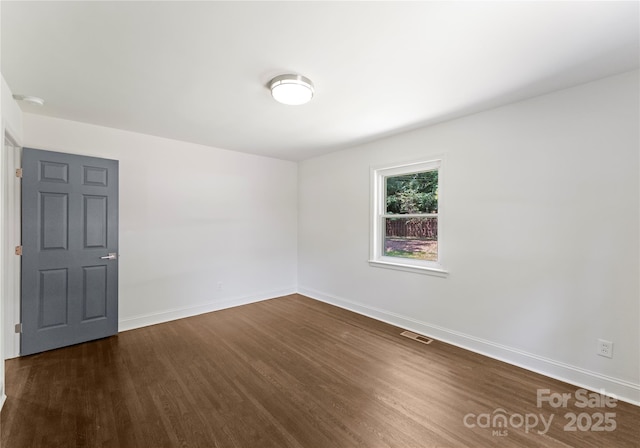 1027 Dresden Dr W, Charlotte, NC 28205 - empty room featuring wood finished floors and baseboards