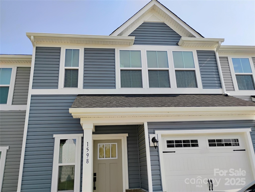 1598 Respect St, Concord, NC 28027 - view of property featuring a garage and roof with shingles