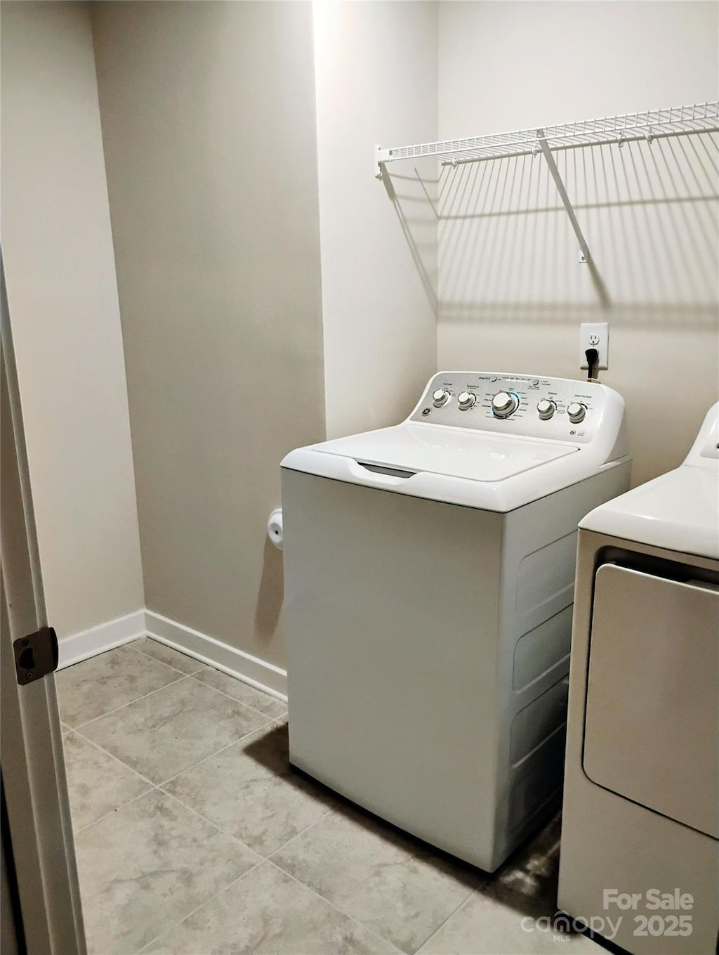 1598 Respect St, Concord, NC 28027 - laundry room featuring washing machine and dryer, baseboards, and light tile patterned floors