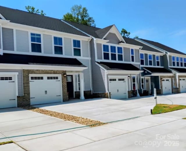 1598 Respect St, Concord, NC 28027 - view of property featuring concrete driveway and an attached garage