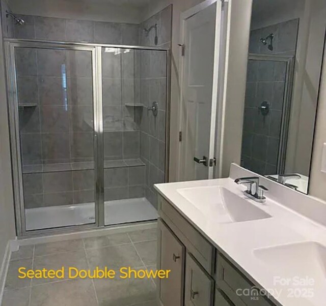 1598 Respect St, Concord, NC 28027 - full bath featuring tile patterned floors, a stall shower, and double vanity