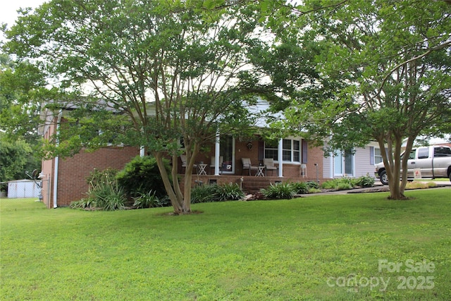 116 Woodbark Ln, Kings Mountain, NC 28086 - obstructed view of property with brick siding and a porch