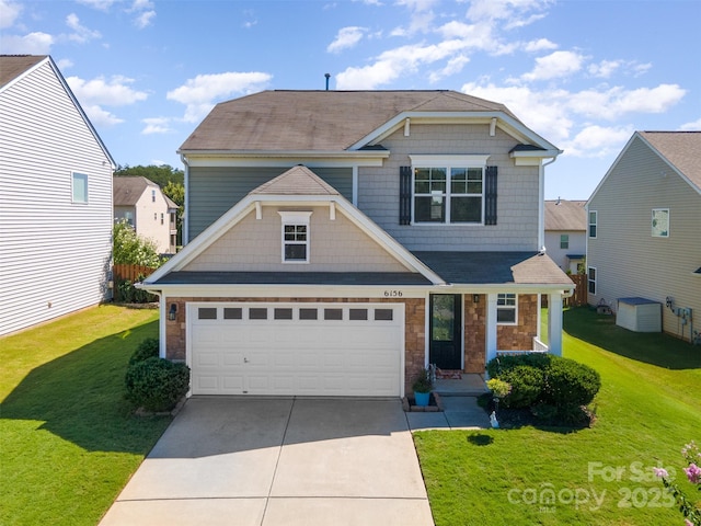 6156 Kilchurn Dr, Fort Mill, SC 29707 - view of front of home featuring driveway, a front yard, and stone siding