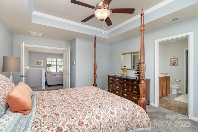 6156 Kilchurn Dr, Fort Mill, SC 29707 - bedroom featuring light colored carpet, crown molding, a tray ceiling, connected bathroom, and a ceiling fan