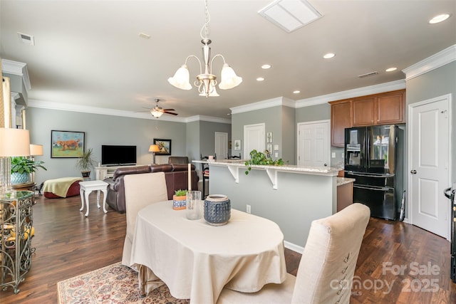 6156 Kilchurn Dr, Fort Mill, SC 29707 - dining space featuring ceiling fan, dark wood-style flooring, crown molding, recessed lighting, and a chandelier