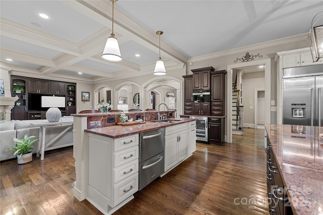 617 Beauhaven Ln, Waxhaw, NC 28173 - kitchen with appliances with stainless steel finishes, wine cooler, open floor plan, light stone countertops, and dark brown cabinets