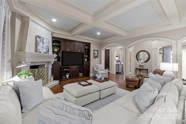 617 Beauhaven Ln, Waxhaw, NC 28173 - living room featuring arched walkways, ornamental molding, beamed ceiling, a fireplace, and coffered ceiling