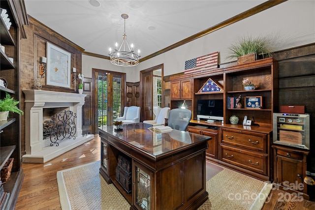 617 Beauhaven Ln, Waxhaw, NC 28173 - home office with ornamental molding, a chandelier, light wood finished floors, french doors, and a fireplace with raised hearth