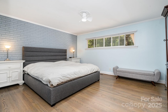 5742 Murrayhill Rd, Charlotte, NC 28210 - bedroom with brick wall, ornamental molding, and wood finished floors