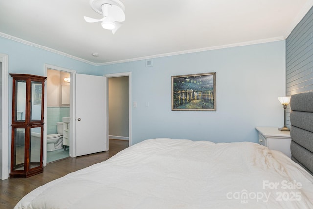 5742 Murrayhill Rd, Charlotte, NC 28210 - bedroom featuring crown molding, dark wood finished floors, ensuite bathroom, and tile walls