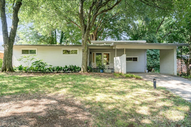 5742 Murrayhill Rd, Charlotte, NC 28210 - view of front of house featuring driveway, a carport, and a front lawn