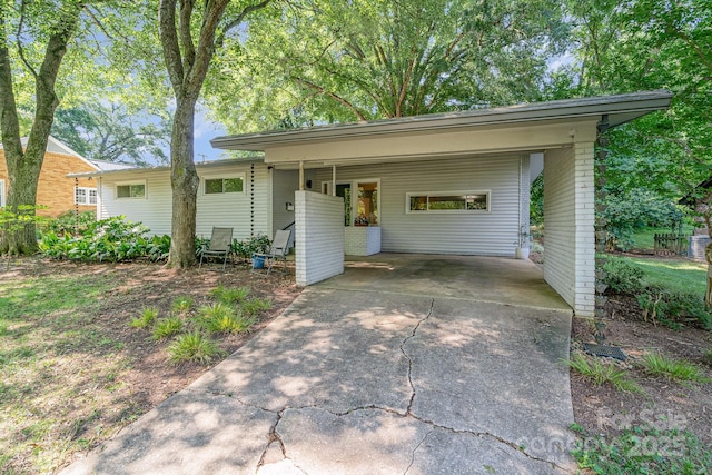 5742 Murrayhill Rd, Charlotte, NC 28210 - view of front of property featuring driveway and an attached carport