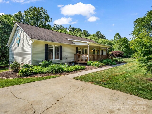 2941 Nix Creek Rd, Marion, NC 28752 - single story home featuring covered porch, a front yard, and a shingled roof