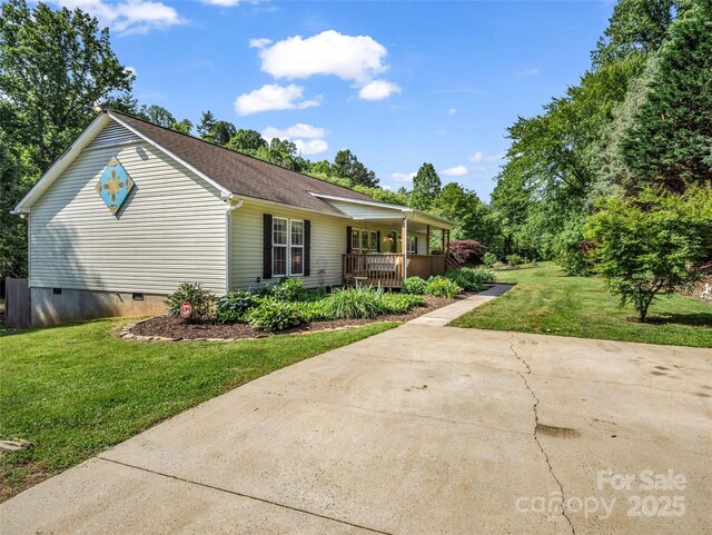 2941 Nix Creek Rd, Marion, NC 28752 - view of front facade with a porch, crawl space, and a front lawn