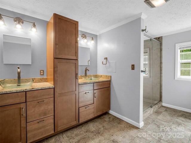 2941 Nix Creek Rd, Marion, NC 28752 - full bath featuring a shower stall, two vanities, crown molding, baseboards, and a textured ceiling