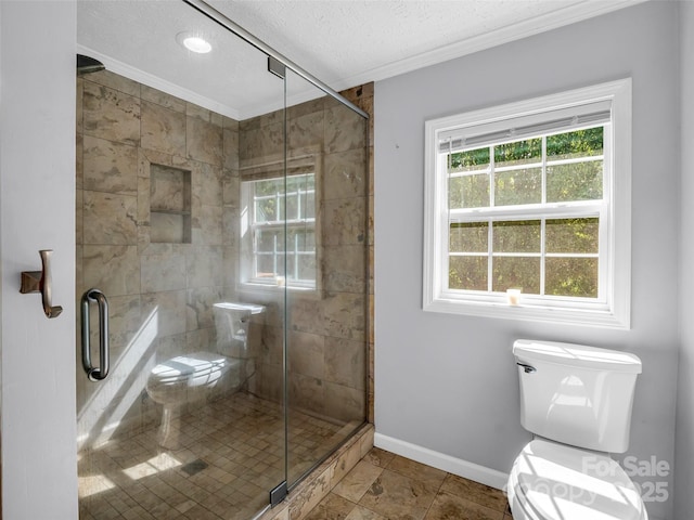 2941 Nix Creek Rd, Marion, NC 28752 - bathroom featuring crown molding, toilet, plenty of natural light, baseboards, and a shower stall