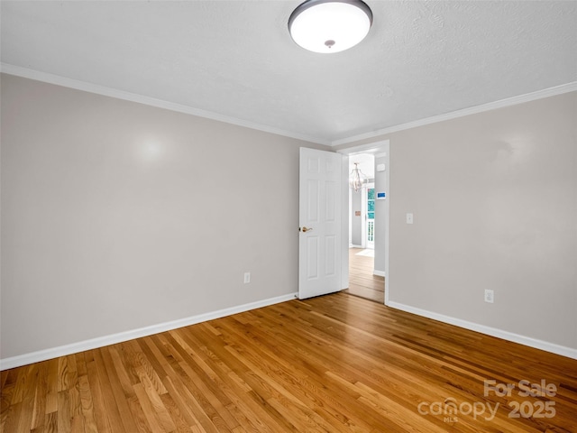 2941 Nix Creek Rd, Marion, NC 28752 - empty room with baseboards, light wood-style floors, and ornamental molding