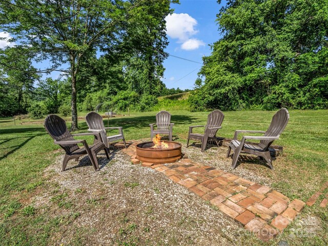 2941 Nix Creek Rd, Marion, NC 28752 - view of green lawn with an outdoor fire pit