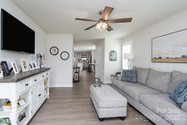 154 Stella Ln Unit A, Troutman, NC 28166 - living room with a ceiling fan and light wood finished floors