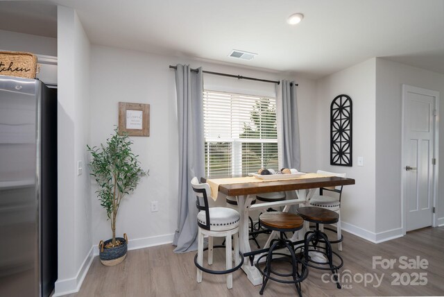 154 Stella Ln Unit A, Troutman, NC 28166 - dining room featuring wood finished floors and baseboards