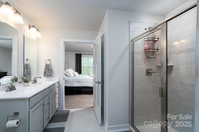 154 Stella Ln Unit A, Troutman, NC 28166 - full bath featuring ensuite bathroom, double vanity, a stall shower, and tile patterned flooring