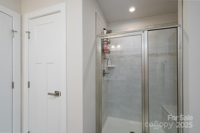 154 Stella Ln Unit A, Troutman, NC 28166 - bathroom featuring a stall shower and recessed lighting