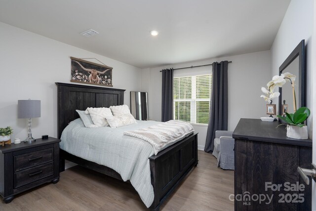 154 Stella Ln Unit A, Troutman, NC 28166 - bedroom with wood finished floors and recessed lighting