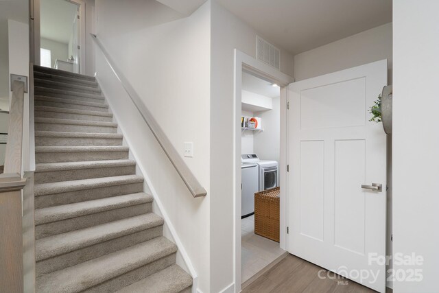 154 Stella Ln Unit A, Troutman, NC 28166 - stairs with separate washer and dryer and wood finished floors