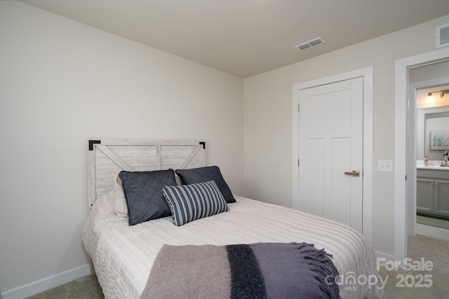154 Stella Ln Unit A, Troutman, NC 28166 - carpeted bedroom with baseboards and ensuite bath