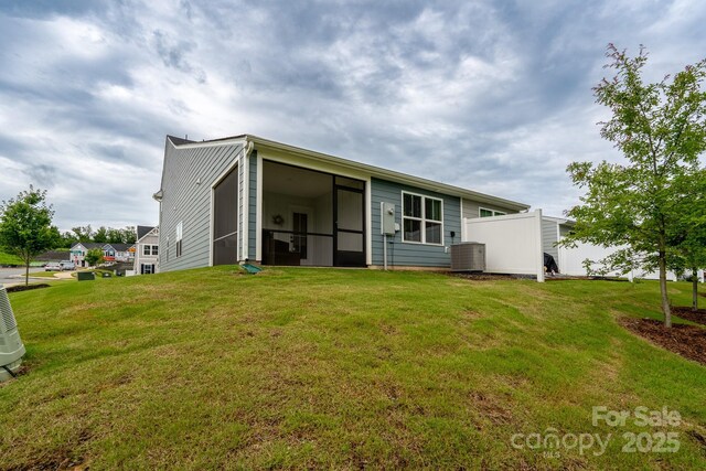 154 Stella Ln Unit A, Troutman, NC 28166 - back of property with a sunroom and a lawn