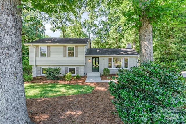 4014 Sulkirk Rd, Charlotte, NC 28210 - tri-level home with brick siding and a chimney