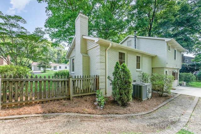 4014 Sulkirk Rd, Charlotte, NC 28210 - view of side of property featuring brick siding and a chimney