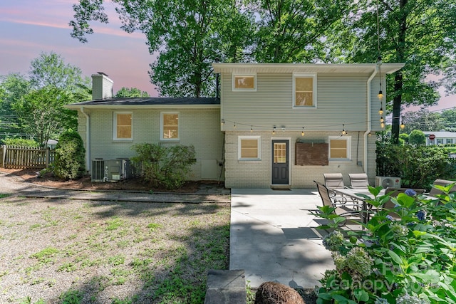4014 Sulkirk Rd, Charlotte, NC 28210 - view of front of property featuring brick siding, a chimney, and a patio
