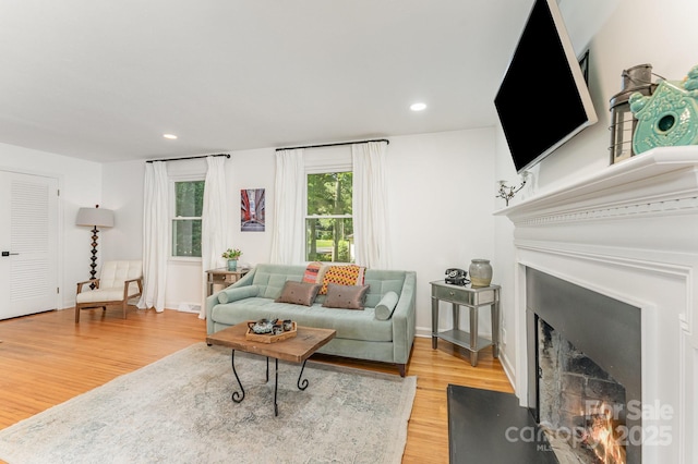 4014 Sulkirk Rd, Charlotte, NC 28210 - living room with light wood-type flooring, a fireplace with flush hearth, and recessed lighting