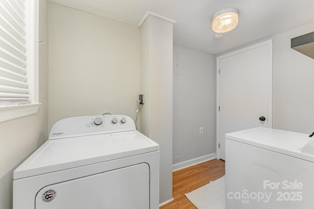4014 Sulkirk Rd, Charlotte, NC 28210 - laundry room with light wood-type flooring and separate washer and dryer