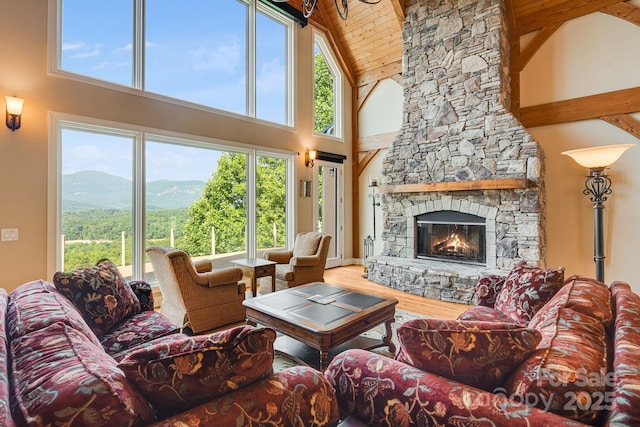 122 Eagles Crest Way, Lake Lure, NC 28746 - living area featuring a wood ceiling with exposed beams, high vaulted ceiling, healthy amount of natural light, wood finished floors, and a mountain view