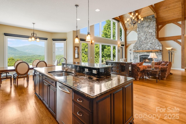 122 Eagles Crest Way, Lake Lure, NC 28746 - kitchen with a chandelier, healthy amount of natural light, stainless steel dishwasher, light wood-type flooring, and lofted ceiling