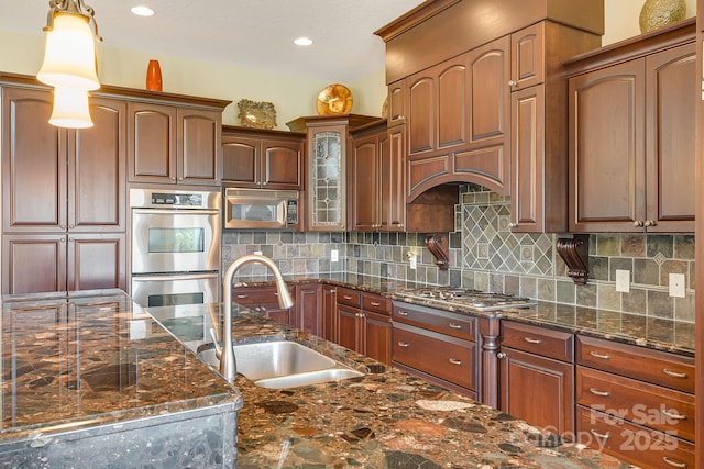 122 Eagles Crest Way, Lake Lure, NC 28746 - kitchen featuring stainless steel appliances, tasteful backsplash, glass insert cabinets, dark stone countertops, and recessed lighting
