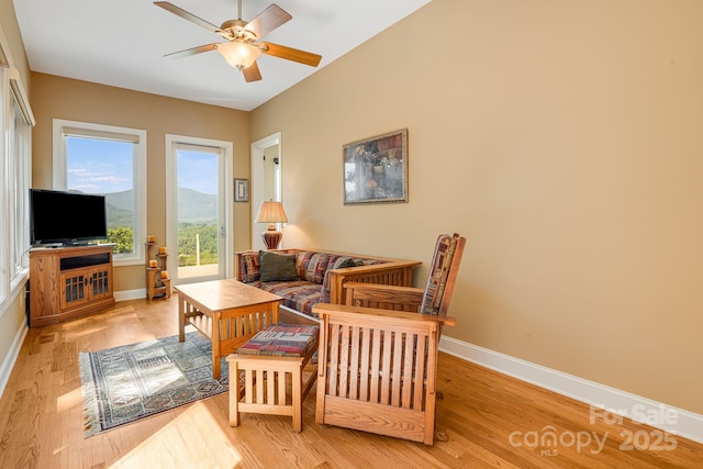 122 Eagles Crest Way, Lake Lure, NC 28746 - living room featuring a ceiling fan and light wood-style flooring