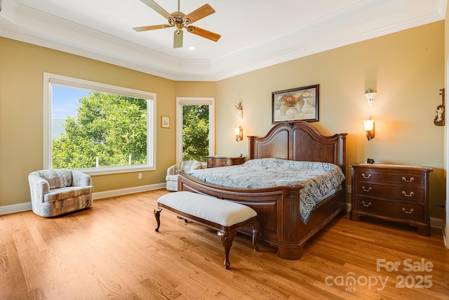 122 Eagles Crest Way, Lake Lure, NC 28746 - bedroom with wood finished floors, crown molding, a ceiling fan, and a raised ceiling