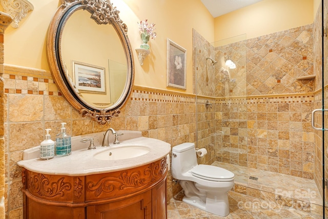 122 Eagles Crest Way, Lake Lure, NC 28746 - full bath with tile walls, vanity, a stall shower, and a wainscoted wall