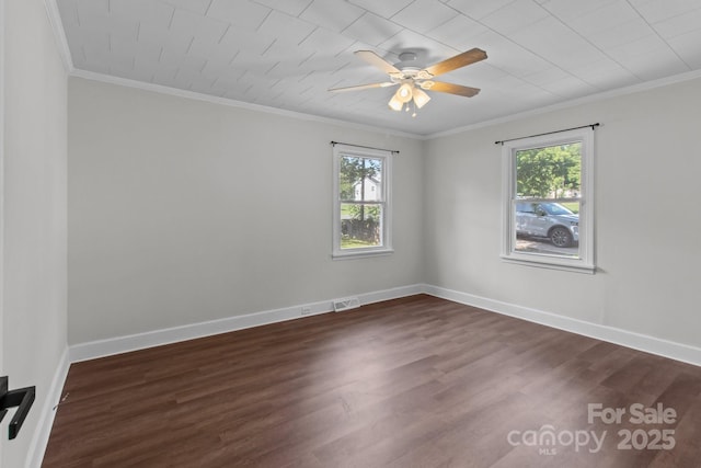 405 E 18th St, Kannapolis, NC 28083 - empty room featuring healthy amount of natural light, ornamental molding, dark wood-style floors, and a ceiling fan