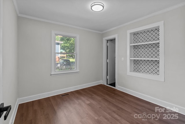 405 E 18th St, Kannapolis, NC 28083 - spare room with ornamental molding and dark wood finished floors